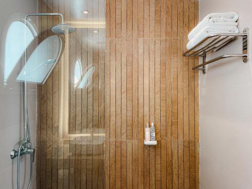 a shower with a glass door in a bathroom at Riad Zyo in Rabat