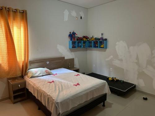 a bedroom with a bed with stars on it at Casa do Pedrão in Eunápolis