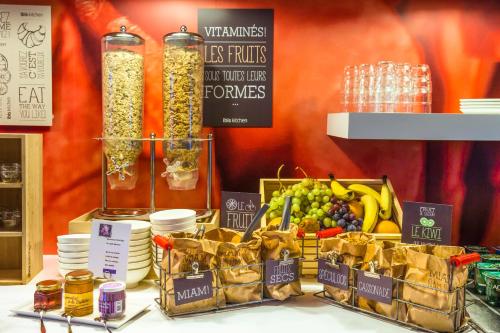 a display of fruits and vegetables on a table at ibis Toulouse Centre in Toulouse