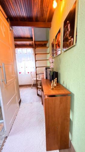 a room with a wooden desk in a room at Loft Desingn in Volta Redonda