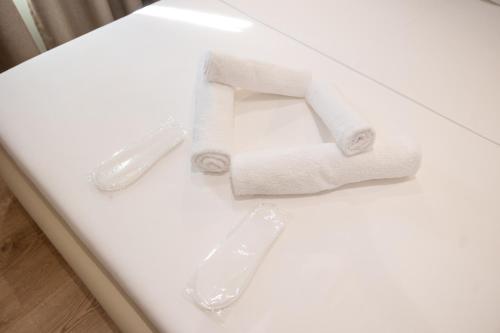 a toilet paper holder with the number six on it at Hotel Petro in Vlorë