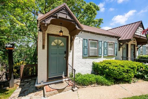 a small house with a green door on a street at Historic Riverview Inn One in Chattanooga