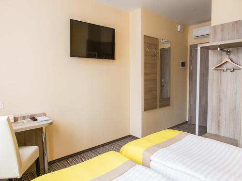Postel nebo postele na pokoji v ubytování Raziotel Kyiv Yamska