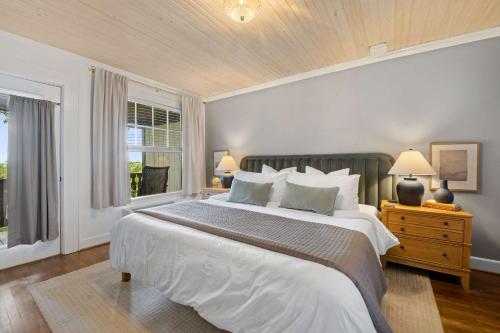 a bedroom with a large bed and a window at Historic Riverview Inn Two in Chattanooga