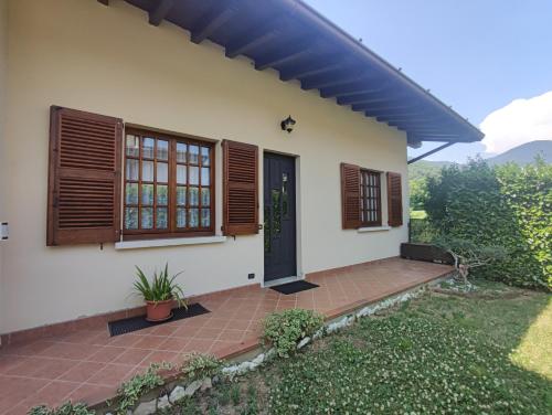 a house with a door and windows and a patio at Alveare 27 in Monticelli Brusati