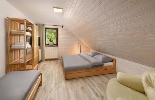 a bedroom with two beds in a room at Apartmany Izbica in Červený Kláštor