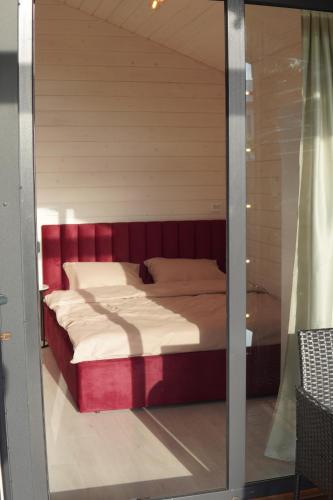 a large bed in a room with a window at Runa House in Verkhovyna