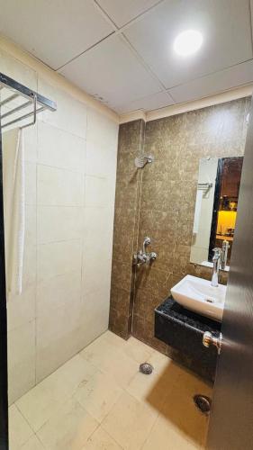 a bathroom with a shower and a sink at Moon escape studio in Ghaziabad