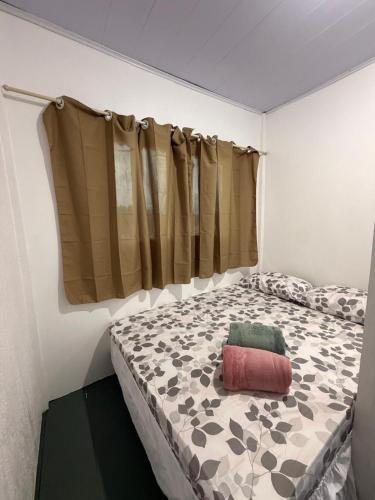 a bedroom with a large bed with avertisement at casa sol in Bragança