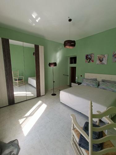 a bedroom with a bed and a room with a mirror at La terrazza sul fiume in Spoleto