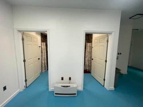 a room with two doors and a sink in the middle at Happy Trails Hideout #2 in Houston