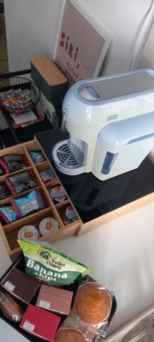 a toaster sitting on a counter next to some food at Casa Teresa in Rome