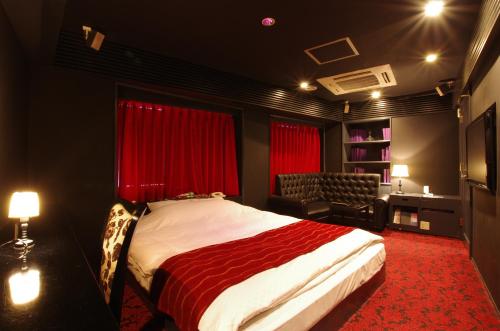 Tempat tidur dalam kamar di Blue Hotel Octa (Adult Only)