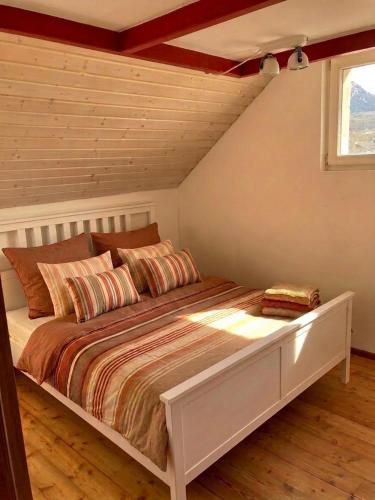a bedroom with a large bed in a room at Serravalle - Casermetta in Malvaglia