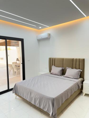 a bedroom with a large bed in a room at Villa VIP in Midoun