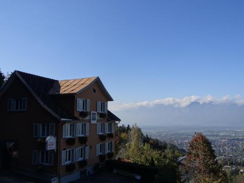 a building on the side of a hill with a view at Waldrast Bed & Breakfast in Batschuns