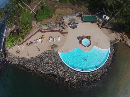 an aerial view of a swimming pool on a beach at Club Santana Beach & Resort in Santana