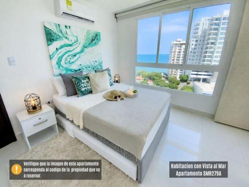 a bedroom with a bed with a dog laying on it at Neos Apartments – Near the Sea by SOHO in Santa Marta