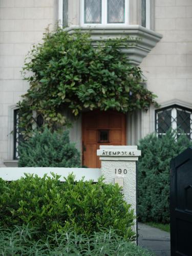 a house with a sign in front of a door at Atemporal by Andean in Lima