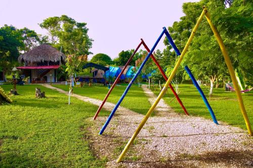 a park with a bunch of playground equipment at Glamping Tesoro Escondido in San Antero