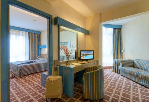 Postel nebo postele na pokoji v ubytování Hotel Federico II