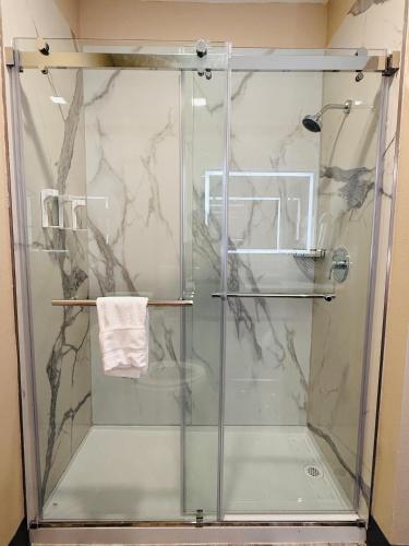 a shower with a glass door in a bathroom at La Quinta by Wyndham Morgan City in Morgan City