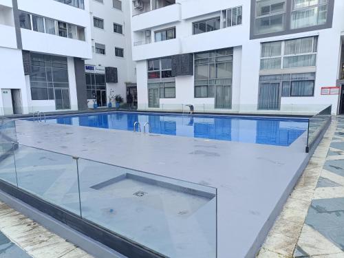 an empty swimming pool in a building at Tanger City 6 in Tangier