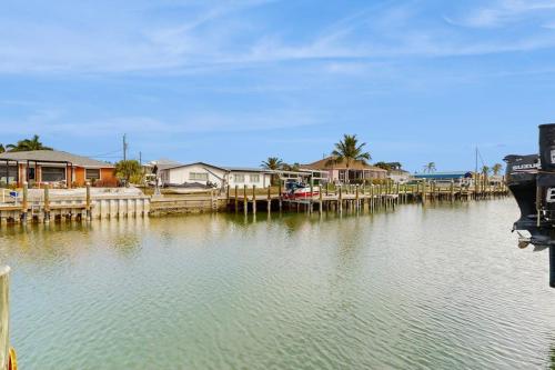 a body of water with houses and a dock at Diversity in Saint James City