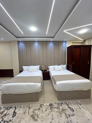 a hotel room with two beds in a room at Casa pyramids hotel in Cairo