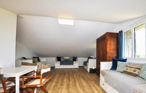 a living room with a couch and a table at Imprenable Villa Piscine in Taulis