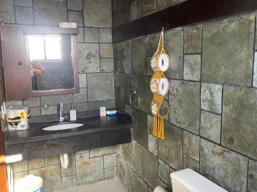 a bathroom with a sink and a mirror at Resort felicidade in Extremóz