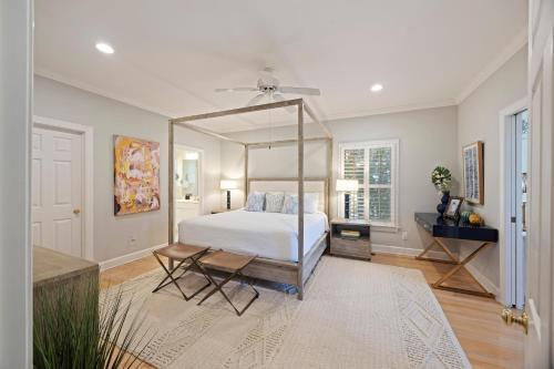 a bedroom with a bed and a large mirror at OG23: 23 Ocean Green in Kiawah Island