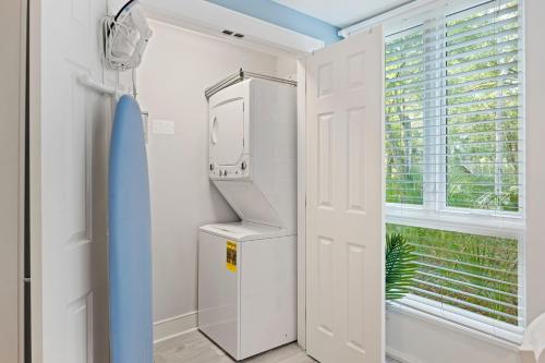 a white refrigerator in a room with a window at SS3524: 3524 Seascape in Kiawah Island