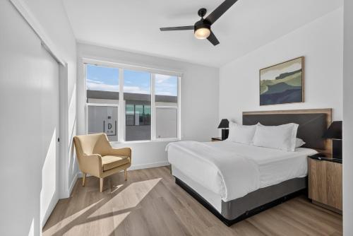 a bedroom with a bed and a chair and a window at Sonoran Oasis with Pool, Spa & BBQ Area in Phoenix