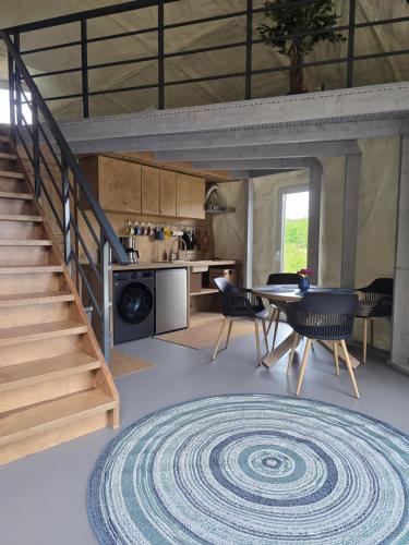 a living room with a spiral rug on the floor at Mullimaja in Treimani