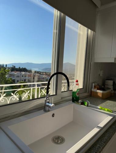 a kitchen sink with a view of a window at Agia Anna Horizon in Kranidi