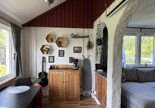 a living room with a couch and a table at Rustic Haven Bed and Breakfast -Entire Private Apartment 2km from Klarälvsbanan and Swimming area in Munkfors