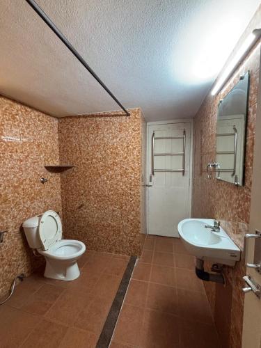 a bathroom with a toilet and a sink at 3bhk villa in Lalbagh in Mangalore