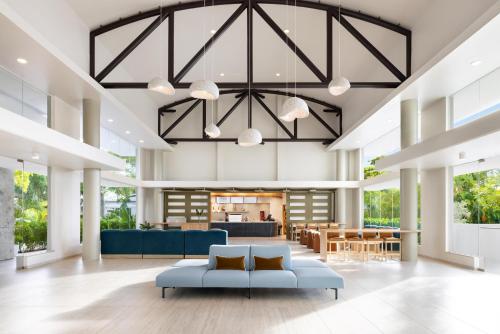 a living room with a blue couch in a lobby at Hyatt Centric San Juan Isla Verde in San Juan