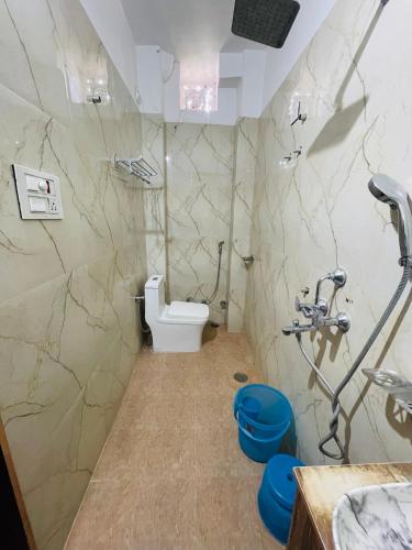 a bathroom with a toilet and a sink at Vedsa haveli new in Udaipur
