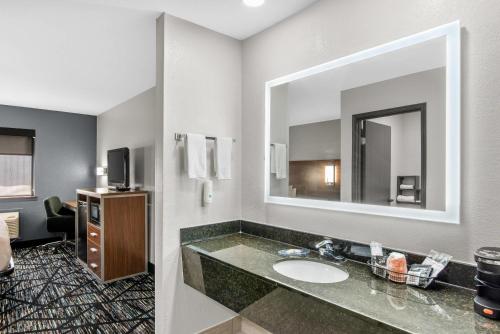 a bathroom with a sink and a mirror at Quality Inn Cedartown in Cedartown