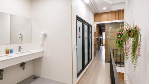 a bathroom with a sink and a mirror at Awesome Hanoi Hostel & Travel in Hanoi