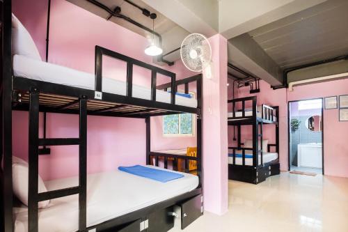 a room with a bunch of bunk beds at Blanco Central in Phi Phi Islands