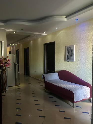 a bedroom with a large bed in a room at Vila Mani in Durrës