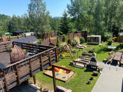 an aerial view of a backyard with a playground at Agroturystyka Blicharzówka Noclegi in Bukówka