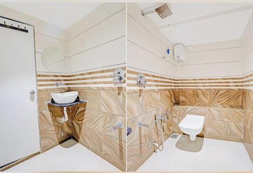 a bathroom with a toilet and a shower at Hotel Planet villa in Ahmedabad