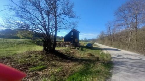 a blue barn on the side of a road at Marin konak in Gornji Milanovac
