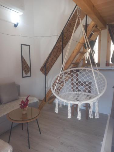 a living room with a swing in a loft at Marin konak in Gornji Milanovac