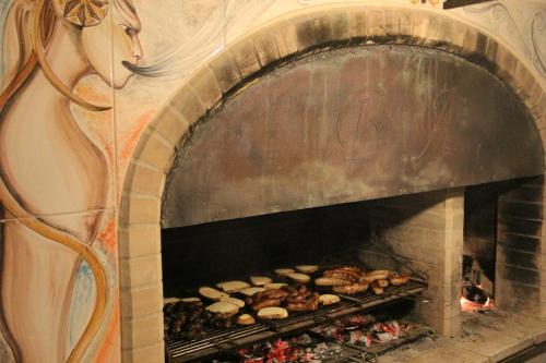 a brick oven with food inside of it at Residence Borgo Antico in Diso