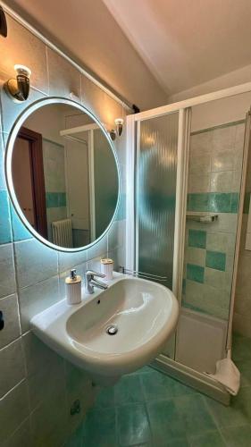 a bathroom with a sink and a mirror at La Ruota del Mulino in Nesso